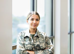 A female soldier standing in her uniform