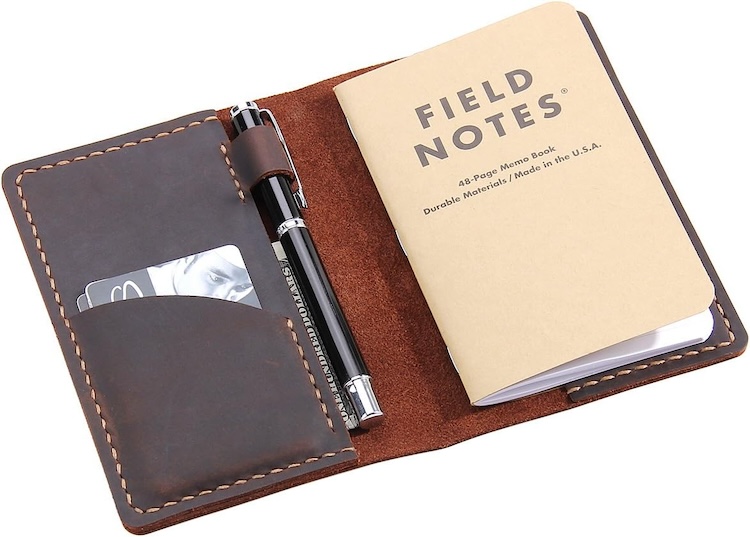 A Field Notes notebook in a leather case
