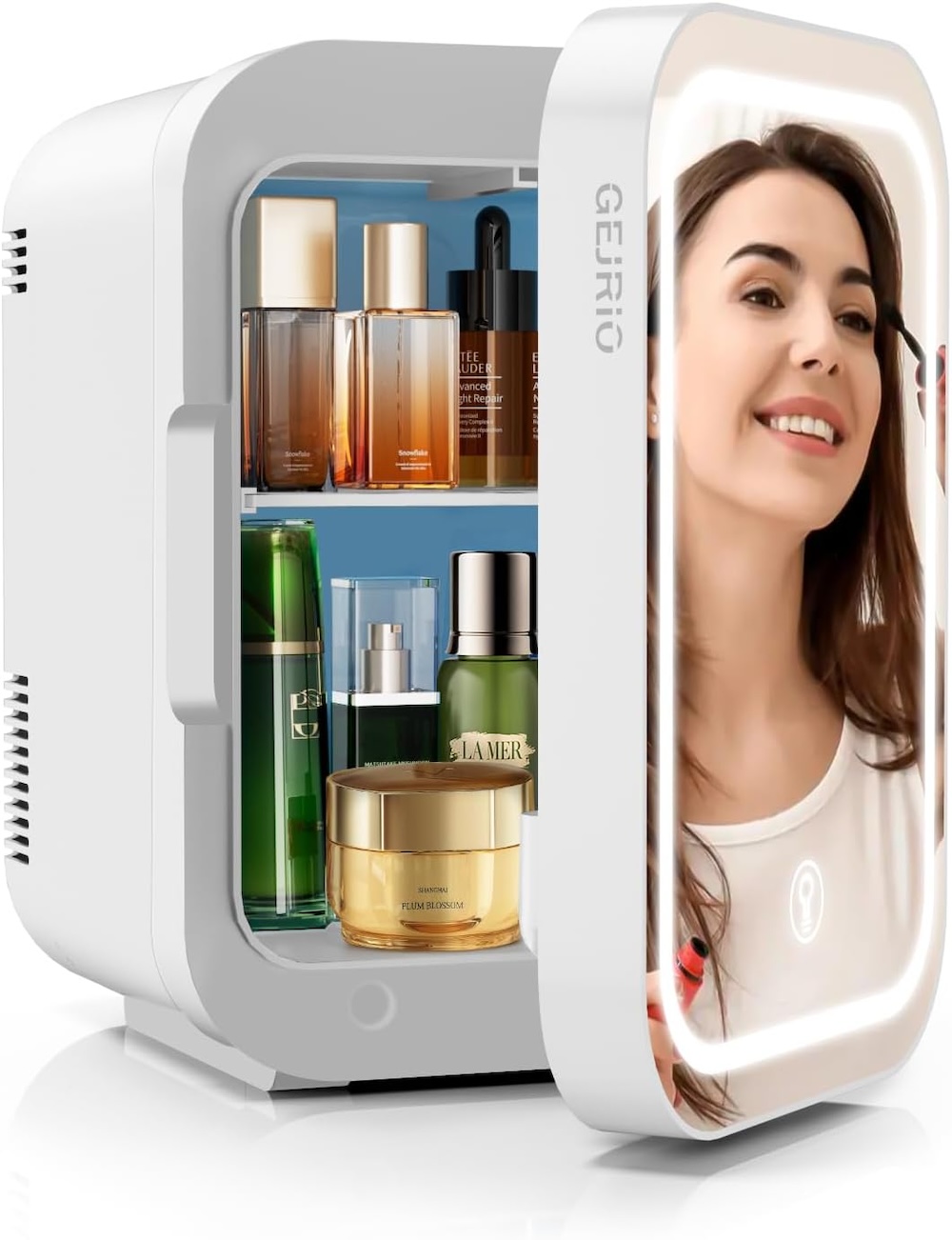 A skincare minifridge with a mirror on the front showing a person applying makeup