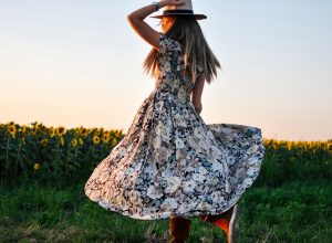 woman in bold floral dress