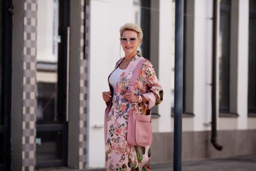fashionable older woman wearing floral spring coat