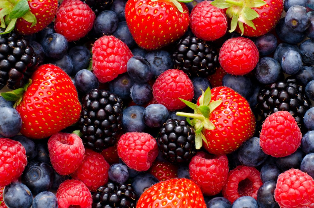 A close up of strawberries, raspberries, blackberries, and blueberries