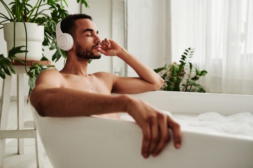 Young man relaxing in bath