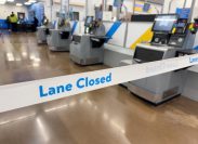 Lane Closed tape in front of Self Checkout registers inside local Walmart Department store.