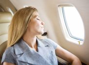 woman sleeping on flight