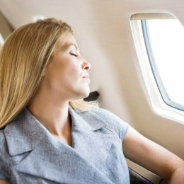 woman sleeping on flight