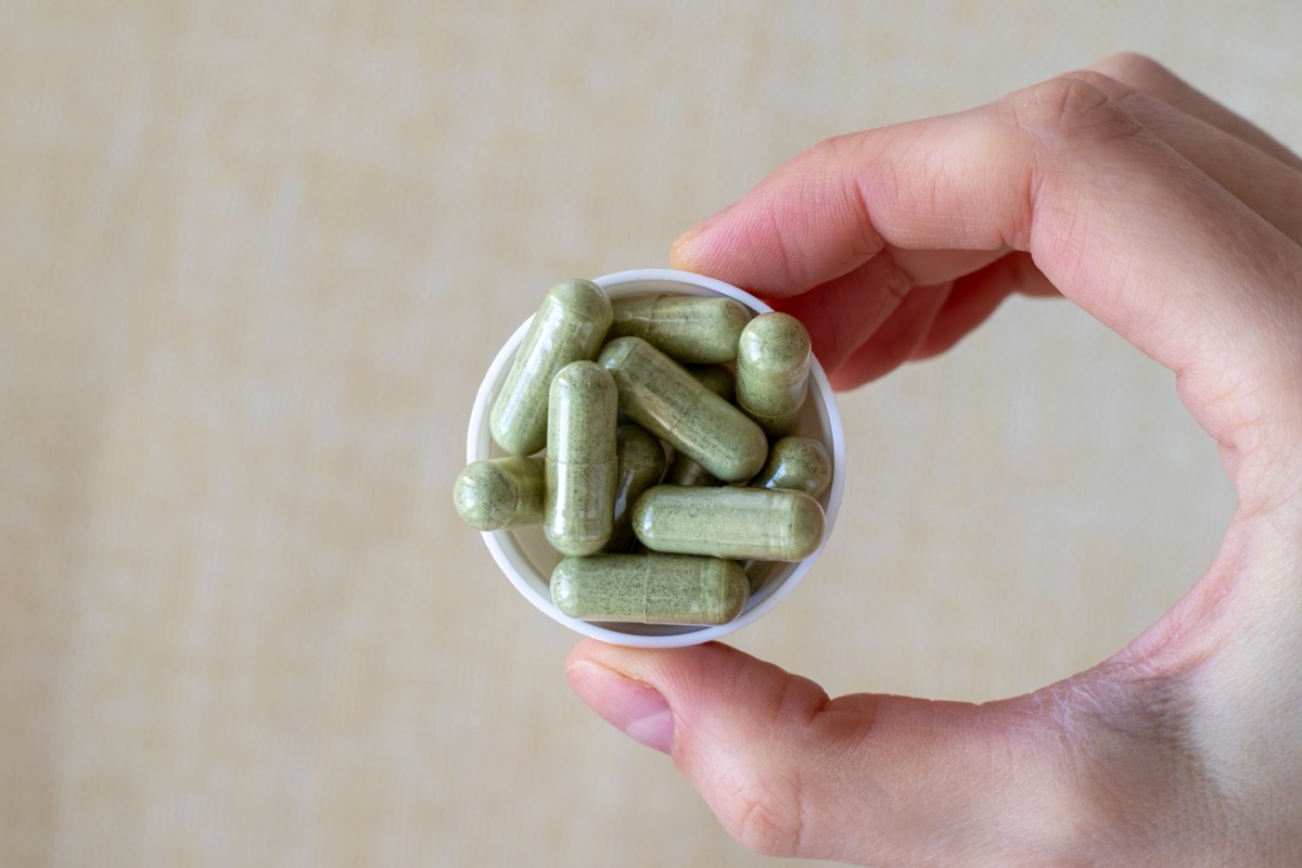 holding capful of fiber supplements