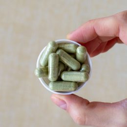 holding capful of fiber supplements