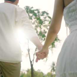 couple on a date holding hands