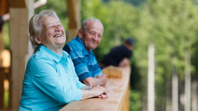 older senior couple laughing