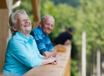older senior couple laughing