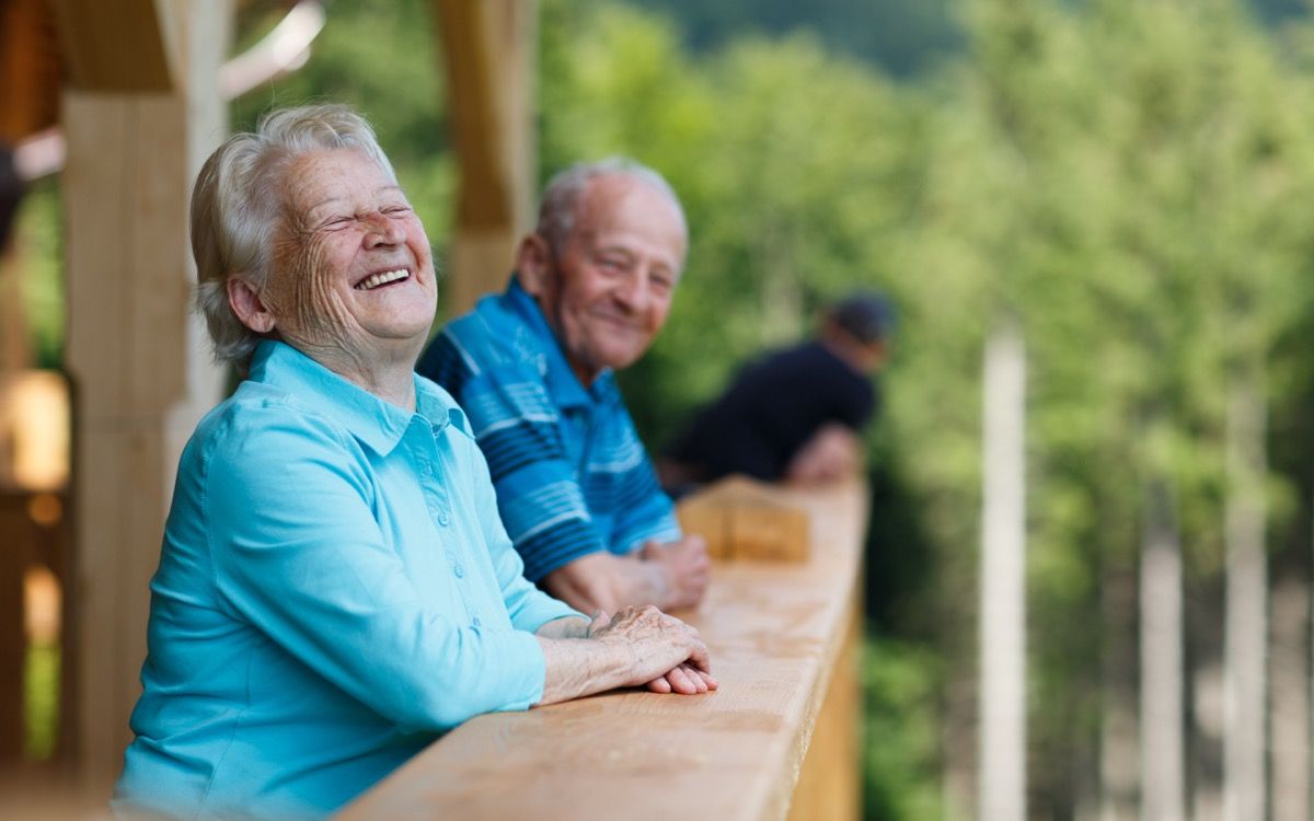 older senior couple laughing