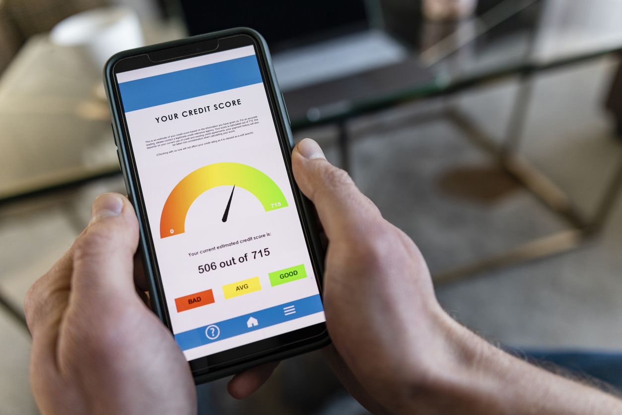 A close up of a smart phone with a person's credit score on it