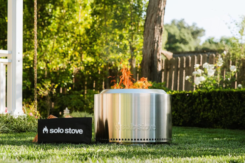 metal fire pit in grass