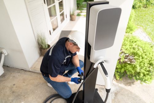 technician installing home EV charging station