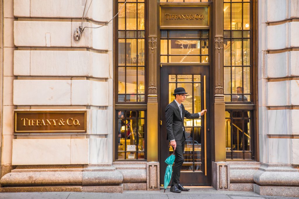 An employee opening the door at a Tiffany & Co. store
