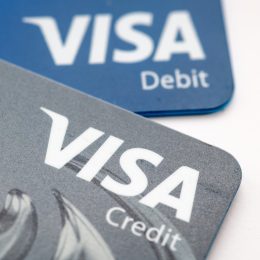 A Visa credit and debit bank card isolated in white.