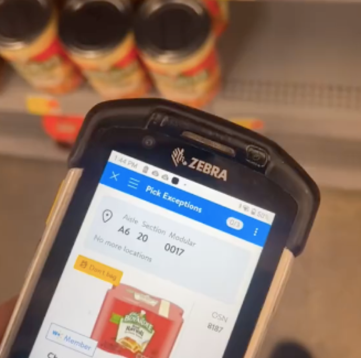 TikTok still of Walmart worker showing out of stock items on the shelves of the store