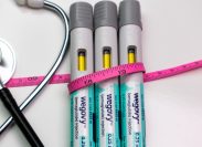 Wegovy auto injector pens with pink tape measure and stethoscope