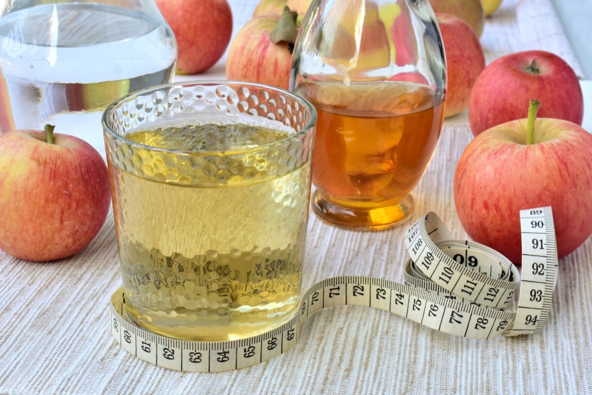 Apple cider vinegar diluted with water, measuring tape