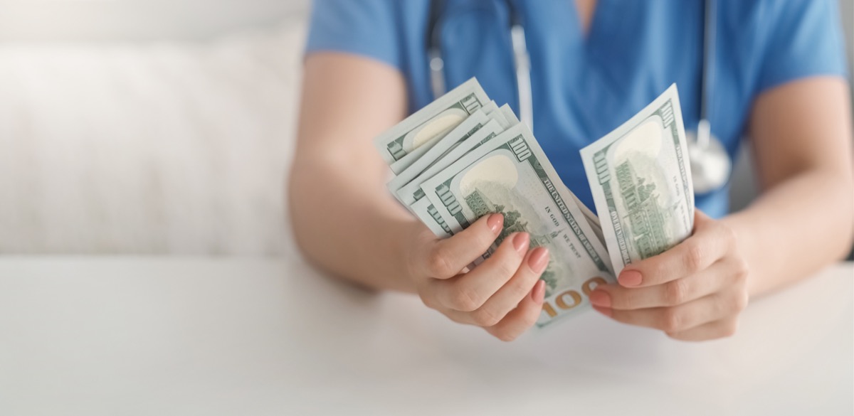 female physician counting money