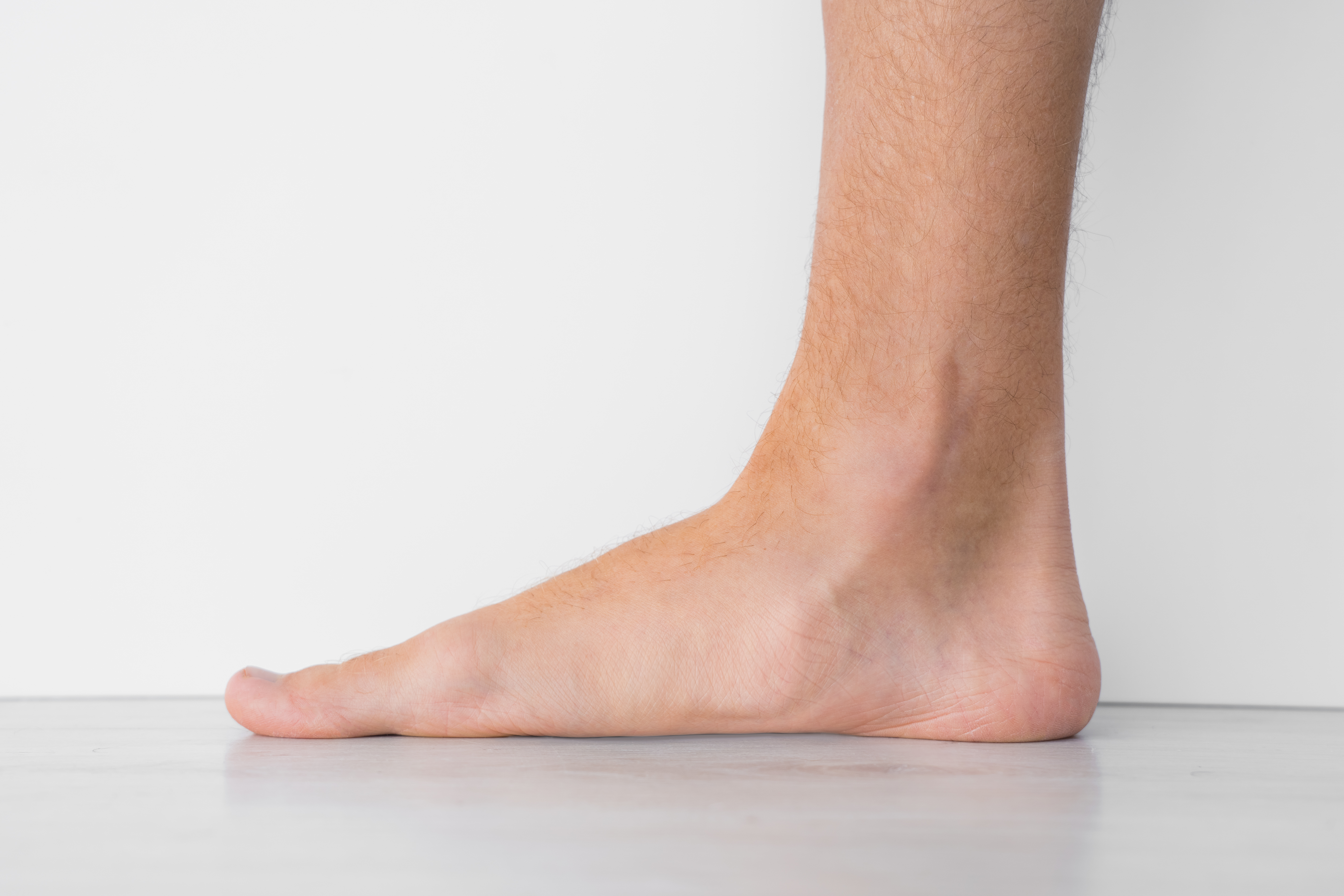 Closeup of mans flat feet