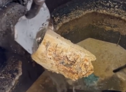 Still from a video showing a drain clogged with grease