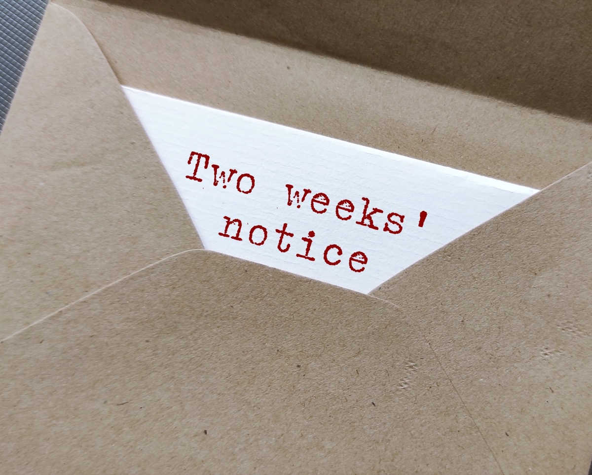 Craft envelope and document with typed text words - Two Weeks' Notice 