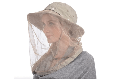 woman wearing a beige safari hat with netting