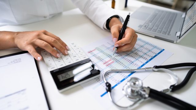woman calculating medical bills