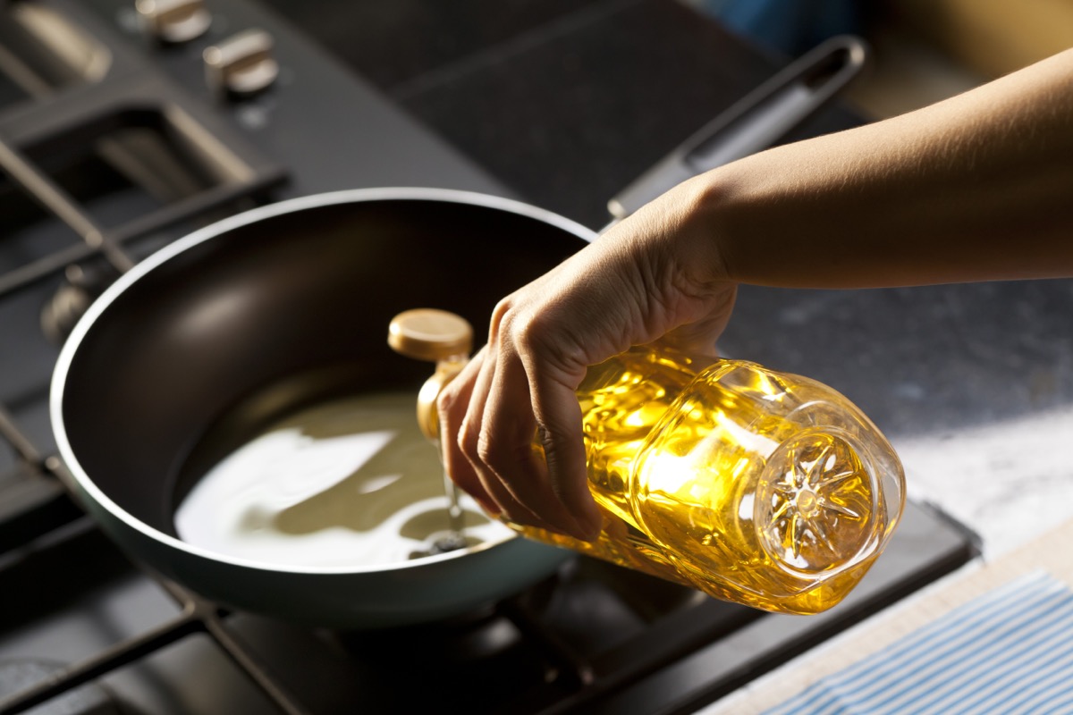 Pouring vegetable oil into frying pan