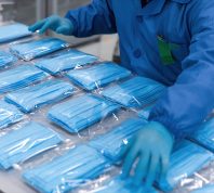 With the global spread of novel coronavirus pneumatia, medical mask production workers are organizing masks to prepare for the epidemic COVID-19 outbreak