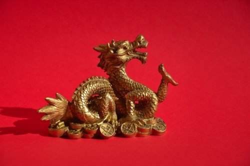 gold dragon against a red background representing the chinese zodiac