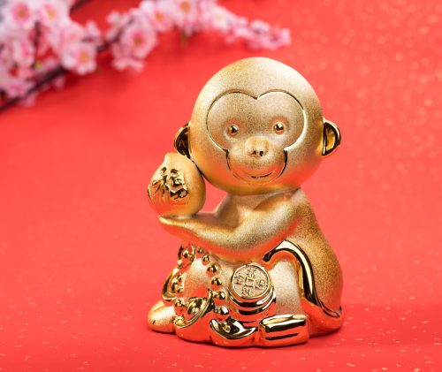gold monkey against a red background representing the chinese zodiac