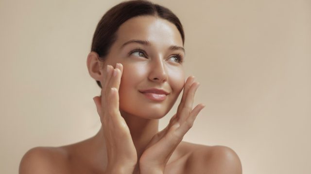 Skincare Beauty Photo of Woman with Clean Healthy Skin Touching Her Face