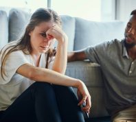 Stress, divorce and couple in living room after a fight, argument or conflict in the marriage at home. Sad, depression or woman with a worried and tired partner cheating thinking of breakup in house