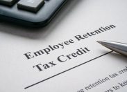 Page with info about employee retention tax credit and pen.