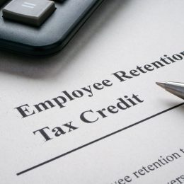 Page with info about employee retention tax credit and pen.