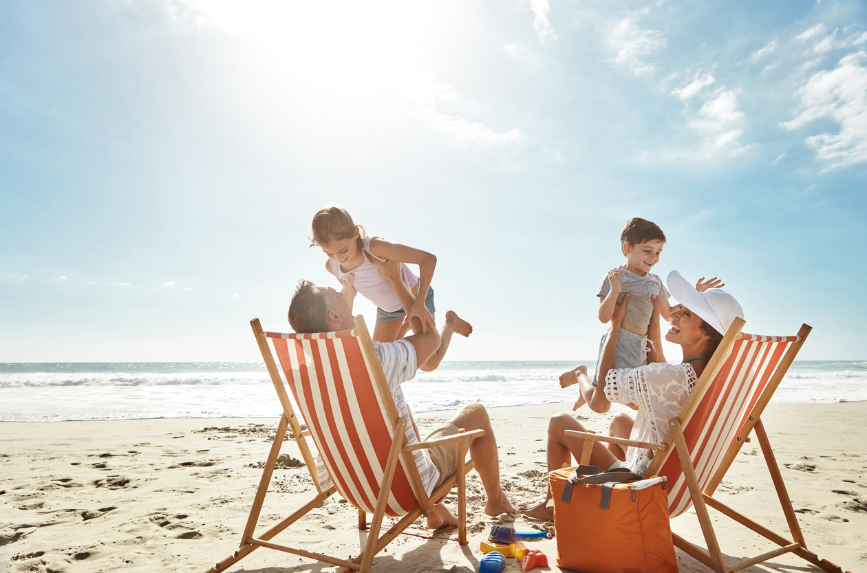 A family on the beach with two children