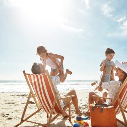 A family on the beach with two children