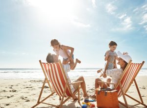 A family on the beach with two children