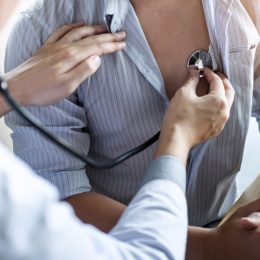 Doctor using a stethoscope checking patient with examining, presenting results symptom and recommend treatment method, Healthcare and medical concept.