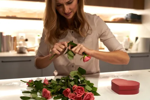 Woman destroying a bunch of roses