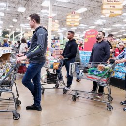 People standing in line at the Kroger grocery store.