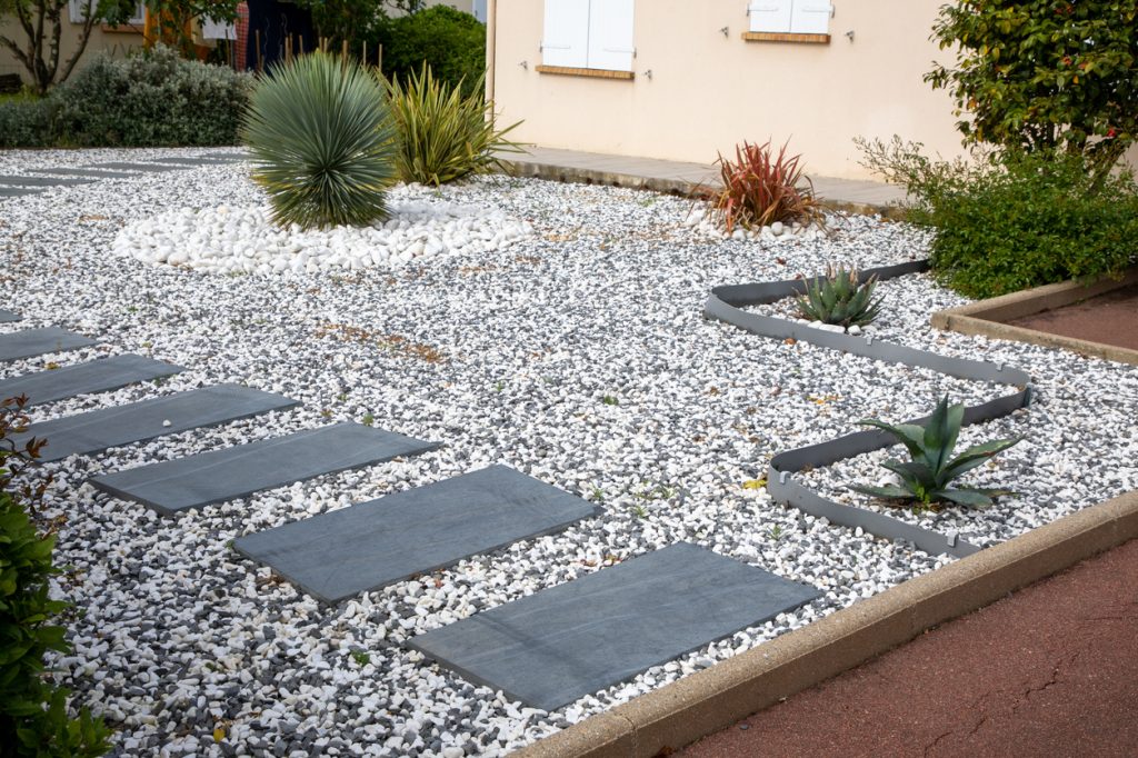 Living gray and white gravel house outdoor with Japanese steps as dry garden