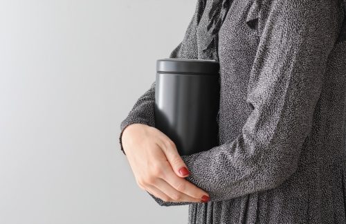 woman holding urn