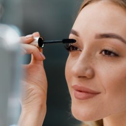 woman applying mascara