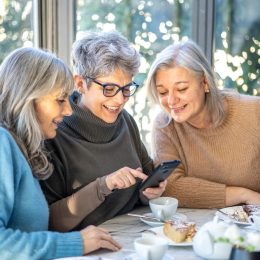 group of three smiling senior women