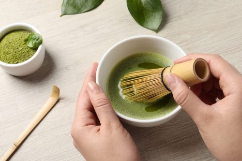 preparing matcha with whisk