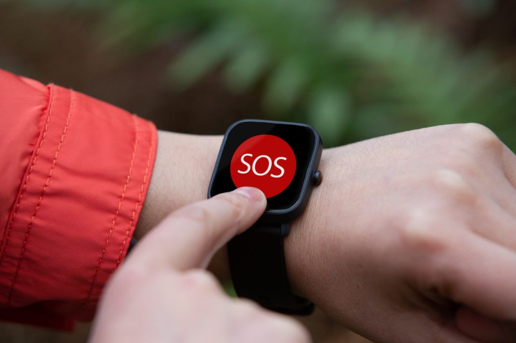 A person using the SOS feature on their smartwatch